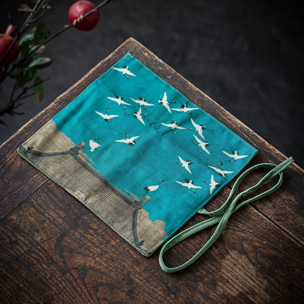 Flying Cranes Gong Fu Cha travel mat displayed on a wooden tea table