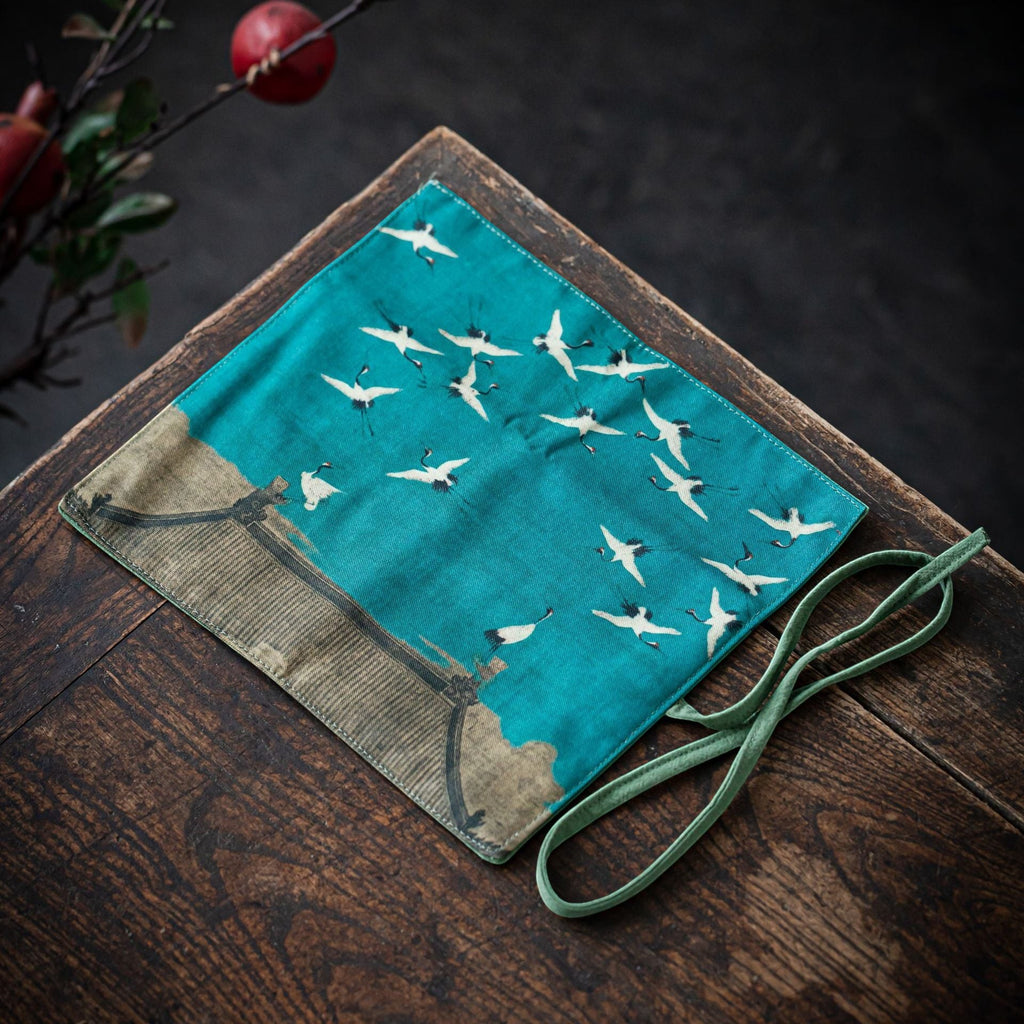 Flying Cranes Gong Fu Cha travel mat displayed on a wooden tea table