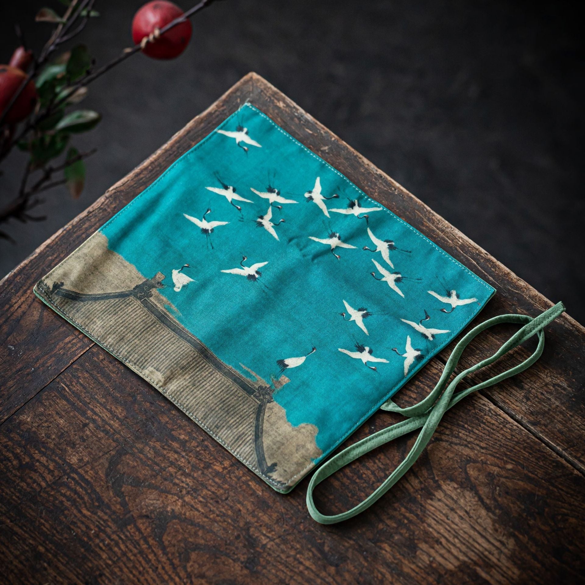 Flying Cranes Gong Fu Cha travel mat displayed on a wooden tea table