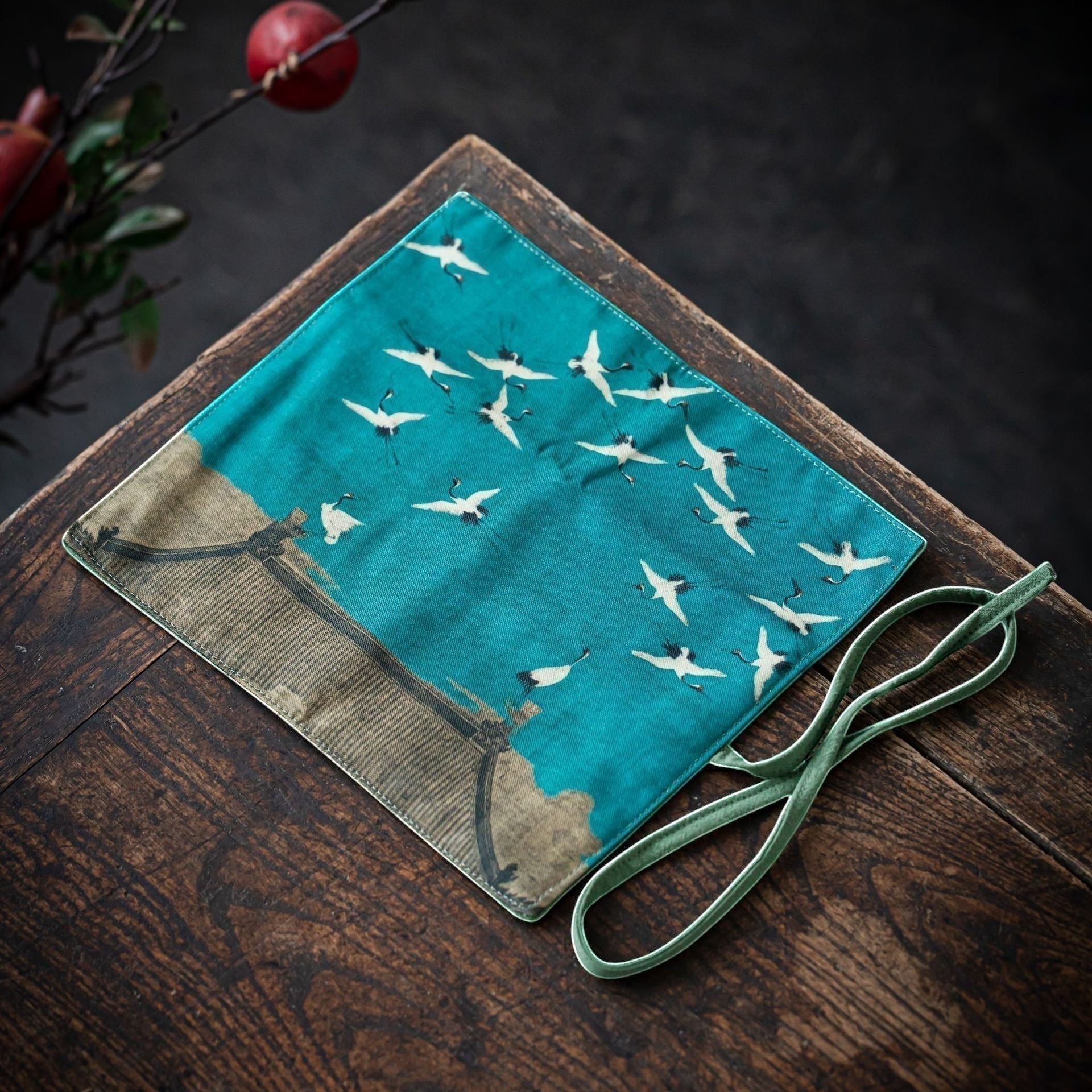 Flying Cranes Gong Fu Cha travel mat displayed on a wooden tea table