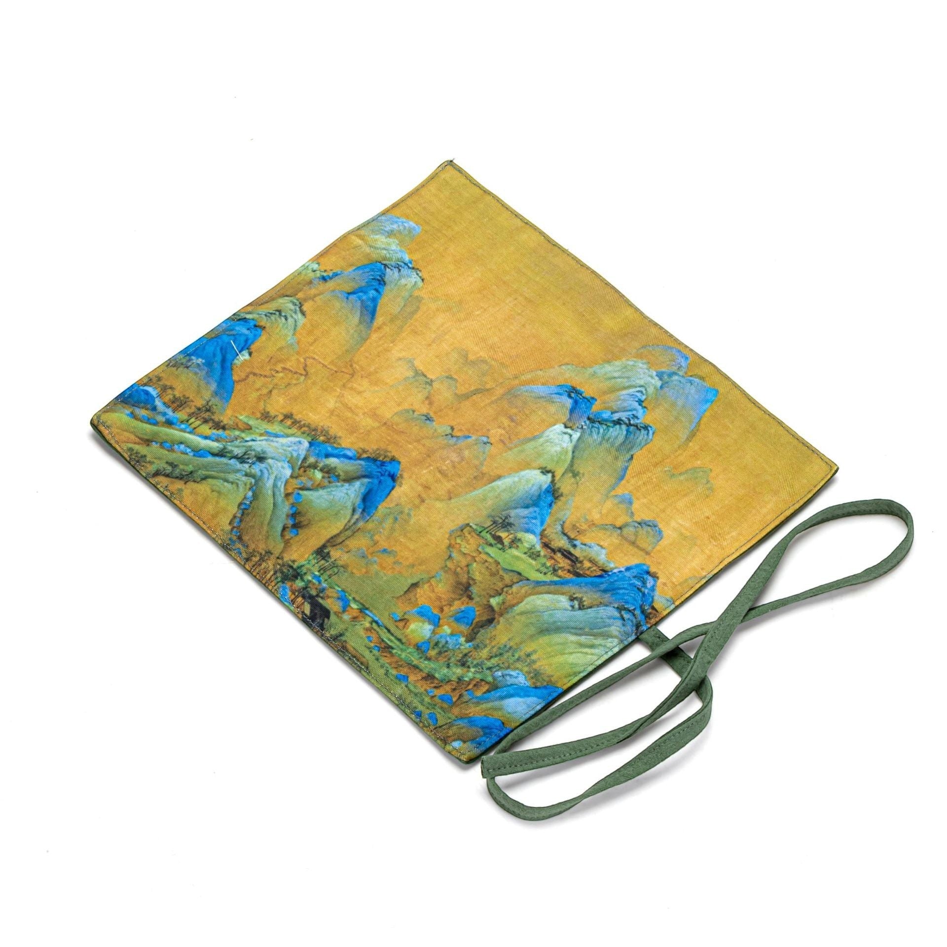 Golden Landscape Gong Fu Cha travel mat displayed on a wooden tea table