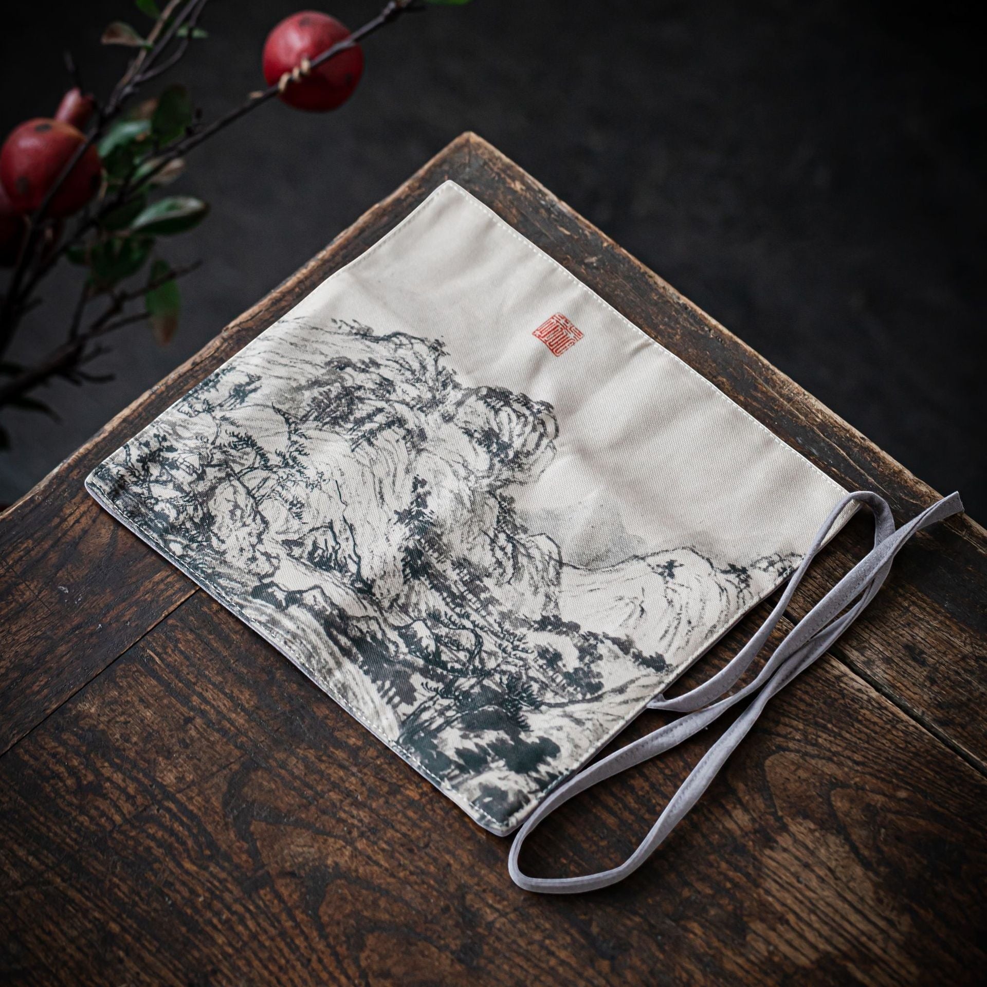 Ink Mountain Gong Fu Cha travel mat displayed on a wooden tea table