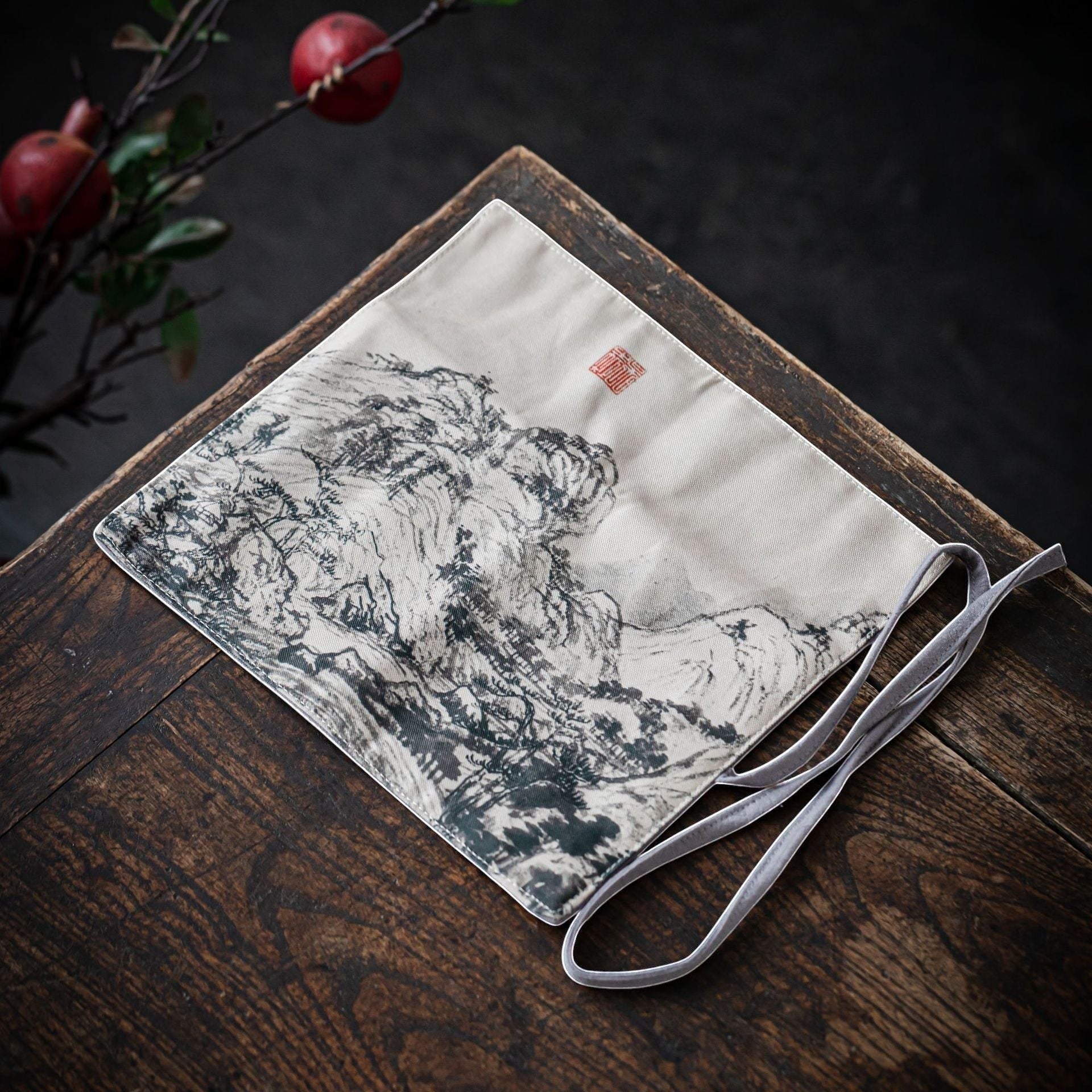 Ink Mountain Gong Fu Cha travel mat displayed on a wooden tea table