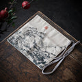 TeArt Space Gong Fu Cha travel mat with Ink Mountain design, fabric, light beige with black ink art.